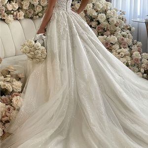 Bridal long gown with a lot of beadwork on the bodice and on the skirt